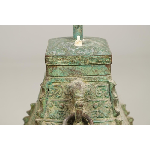 1271 - A PAIR OF CHINESE STYLE ARCHAIC BRONZE TABLE LAMPS. 20th century, with green painted 'patinated' fin... 