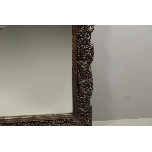 1272 - A PAIR OF EARLY 20TH CENTURY CHINESE CARVED WOODEN WALL MIRRORS. the frames carved and pierced with ... 