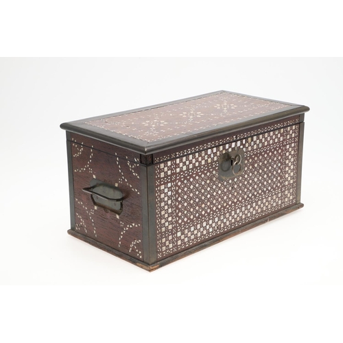 1275 - A MIDDLE EASTERN MOTHER OF PEARL INLAID HARDWOOD BOX. early 20th century, the hinged lid enclosing a... 