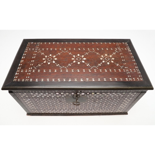 1275 - A MIDDLE EASTERN MOTHER OF PEARL INLAID HARDWOOD BOX. early 20th century, the hinged lid enclosing a... 