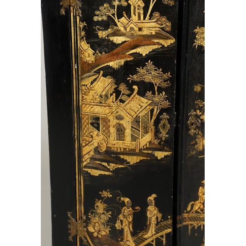 1276 - AN EARLY 20TH CENTURY BLACK CHINOISERIE HANGING CORNER CUPBOARD. the bow front doors gilt decorated ... 