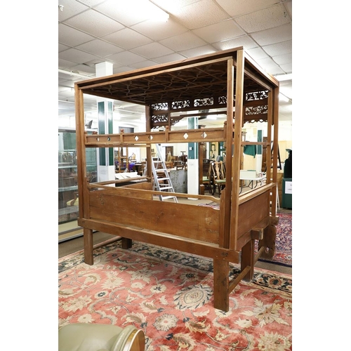 1277 - AN EARLY 20TH CENTURY MEDAN/CHINESE TEAK OPIUM CANOPY BED. the canopy front with seven carved and pi... 