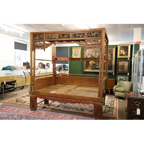 1277 - AN EARLY 20TH CENTURY MEDAN/CHINESE TEAK OPIUM CANOPY BED. the canopy front with seven carved and pi... 