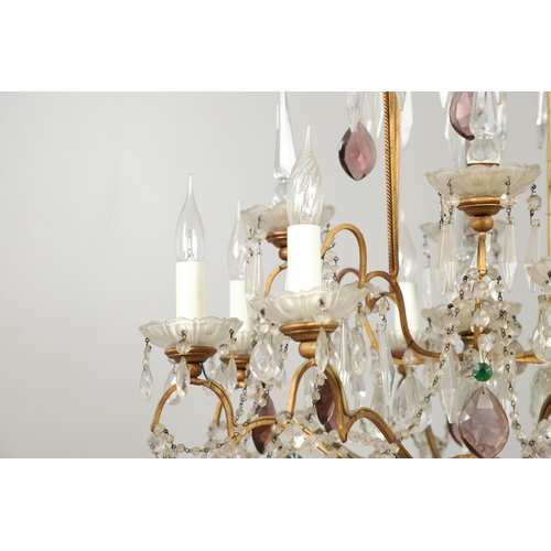 1279 - A 20TH CENTURY TWELVE BRANCH CRYSTAL CHANDELIER. with clear, amethyst and green cut glass drops susp... 