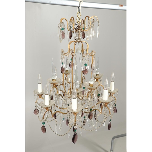 1279 - A 20TH CENTURY TWELVE BRANCH CRYSTAL CHANDELIER. with clear, amethyst and green cut glass drops susp... 