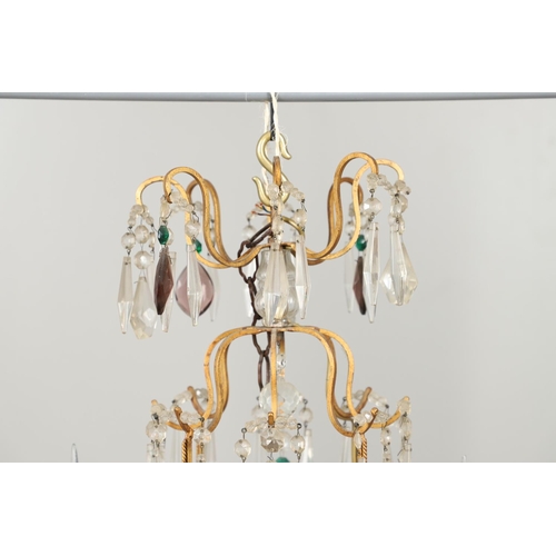 1279 - A 20TH CENTURY TWELVE BRANCH CRYSTAL CHANDELIER. with clear, amethyst and green cut glass drops susp... 