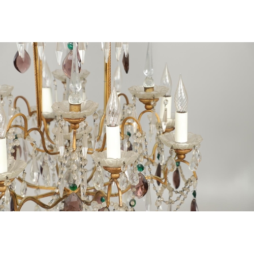 1279 - A 20TH CENTURY TWELVE BRANCH CRYSTAL CHANDELIER. with clear, amethyst and green cut glass drops susp... 