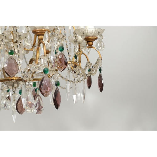 1279 - A 20TH CENTURY TWELVE BRANCH CRYSTAL CHANDELIER. with clear, amethyst and green cut glass drops susp... 