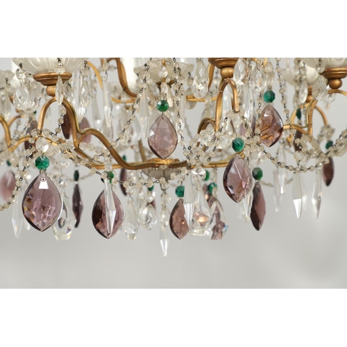 1279 - A 20TH CENTURY TWELVE BRANCH CRYSTAL CHANDELIER. with clear, amethyst and green cut glass drops susp... 