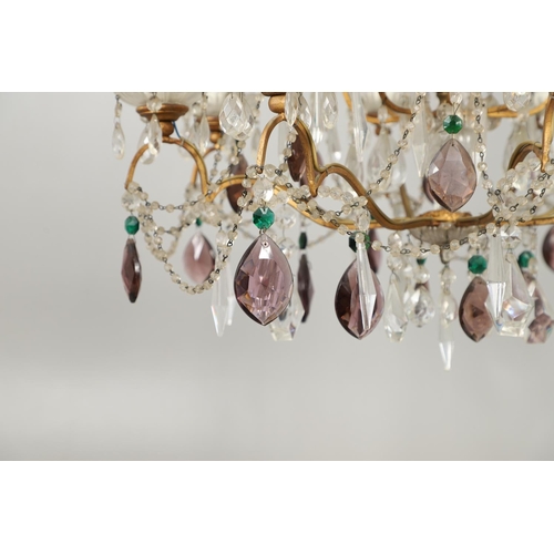 1279 - A 20TH CENTURY TWELVE BRANCH CRYSTAL CHANDELIER. with clear, amethyst and green cut glass drops susp... 