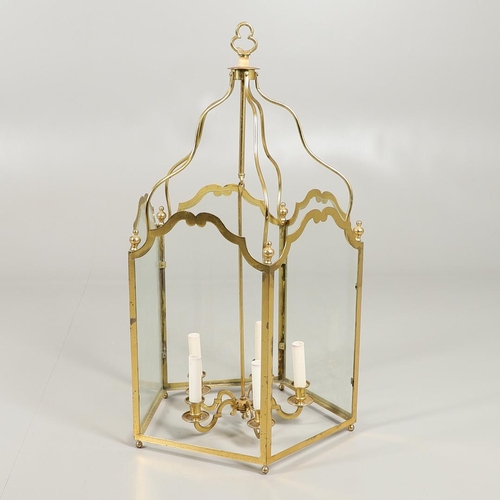 1280 - A 19TH CENTURY FRENCH BRASS HALL LANTERN. with five scroll shaped panels enclosing a central light f... 