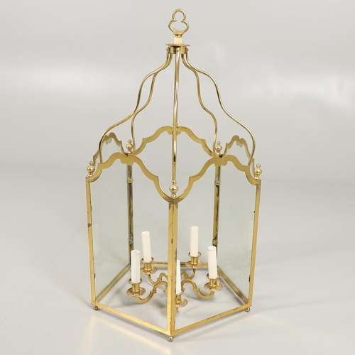 1280 - A 19TH CENTURY FRENCH BRASS HALL LANTERN. with five scroll shaped panels enclosing a central light f... 