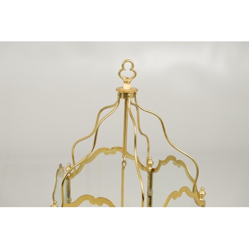 1280 - A 19TH CENTURY FRENCH BRASS HALL LANTERN. with five scroll shaped panels enclosing a central light f... 