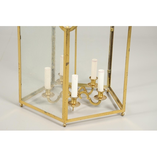 1280 - A 19TH CENTURY FRENCH BRASS HALL LANTERN. with five scroll shaped panels enclosing a central light f... 