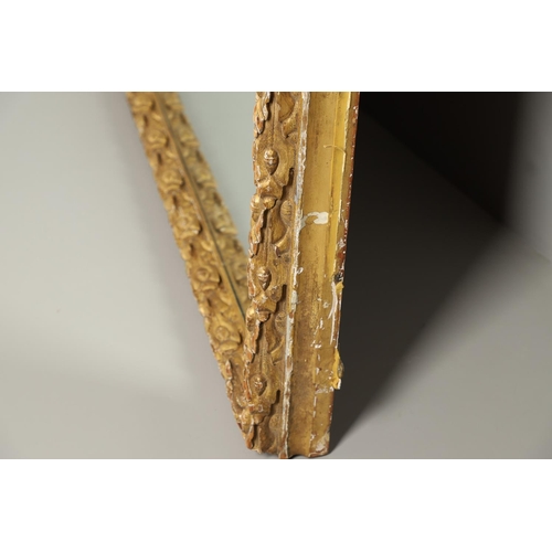 1284 - A SUBSTANTIAL LATE VICTORIAN GILT AND GESSO FRAMED WALL MIRROR. the pine frame with oak leaf and aco... 