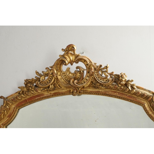 1286 - A LATE 19TH CENTURY GILT GESSO OVERMANTEL MIRROR. the shaped upright rectangular plate within beaded... 