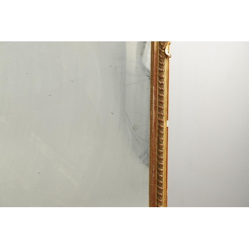 1286 - A LATE 19TH CENTURY GILT GESSO OVERMANTEL MIRROR. the shaped upright rectangular plate within beaded... 