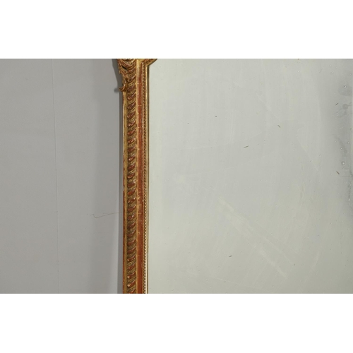 1286 - A LATE 19TH CENTURY GILT GESSO OVERMANTEL MIRROR. the shaped upright rectangular plate within beaded... 