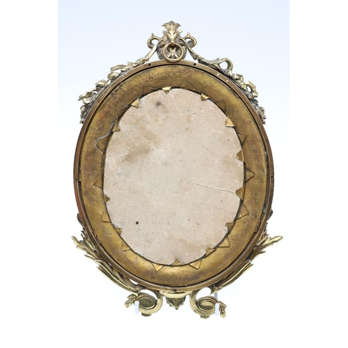 1287 - A SMALL FRENCH GILT METAL AND CHAMPLEVE ENAMEL WALL MIRROR. the oval dished frame with ribbon, scrol... 