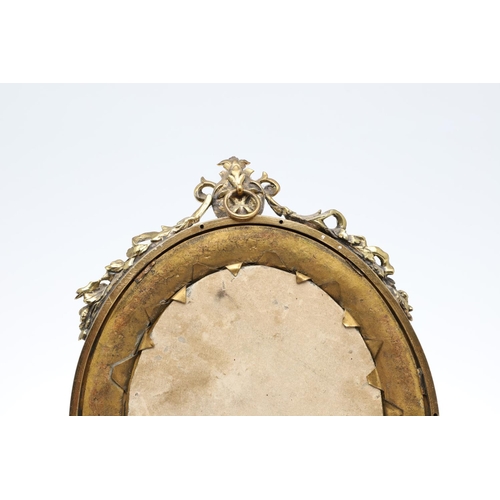 1287 - A SMALL FRENCH GILT METAL AND CHAMPLEVE ENAMEL WALL MIRROR. the oval dished frame with ribbon, scrol... 