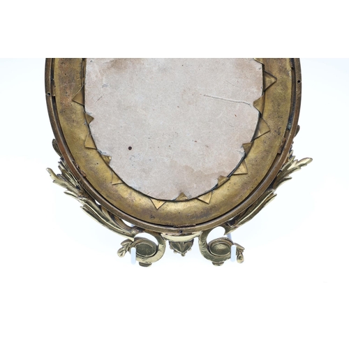 1287 - A SMALL FRENCH GILT METAL AND CHAMPLEVE ENAMEL WALL MIRROR. the oval dished frame with ribbon, scrol... 