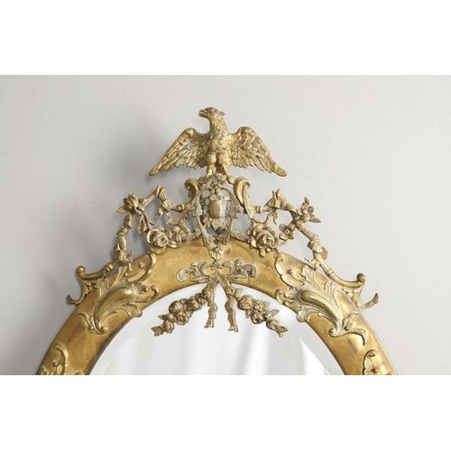 1288 - A LATE 19TH/EARLY 20TH CENTURY CONTINENTAL BRASS 'STRUT' MIRROR. ornately cast with eagle surmount a... 