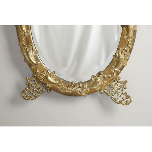 1288 - A LATE 19TH/EARLY 20TH CENTURY CONTINENTAL BRASS 'STRUT' MIRROR. ornately cast with eagle surmount a... 