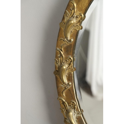 1288 - A LATE 19TH/EARLY 20TH CENTURY CONTINENTAL BRASS 'STRUT' MIRROR. ornately cast with eagle surmount a... 