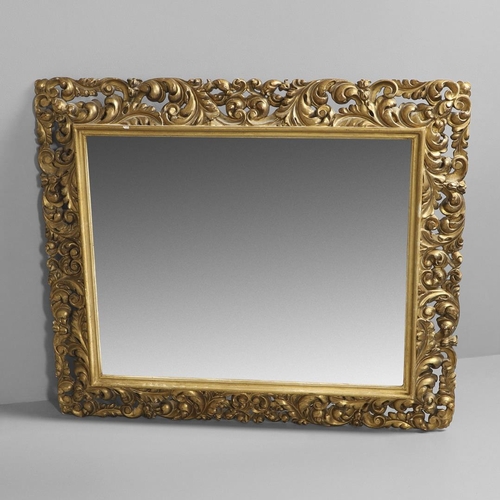 1289 - A 19TH CENTURY CONTINENTAL GILT FRAME MIRROR. the ornately moulded frame with foliate scrolls to a r... 