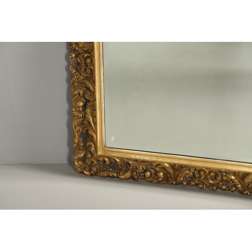 1289 - A 19TH CENTURY CONTINENTAL GILT FRAME MIRROR. the ornately moulded frame with foliate scrolls to a r... 