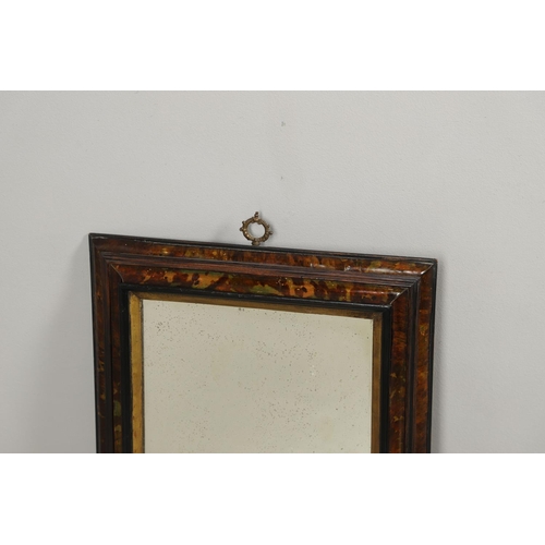 1292 - A 19TH CENTURY TORTOISESHELL WALL MIRROR. the double stepped tortoiseshell frame with inner ebonised... 