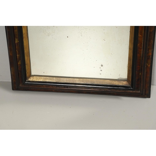 1292 - A 19TH CENTURY TORTOISESHELL WALL MIRROR. the double stepped tortoiseshell frame with inner ebonised... 