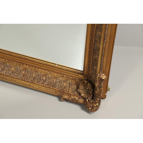 1293 - A LARGE 20TH CENTURY GILT WALL MIRROR. the ornate frame with moulded Classical shell, palmette and b... 