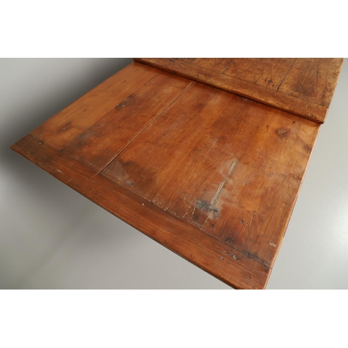 1295 - A 19TH CENTURY FRENCH FRUITWOOD DRAWLEAF FARMHOUSE TABLE. the six plank top to a single drawer at on... 