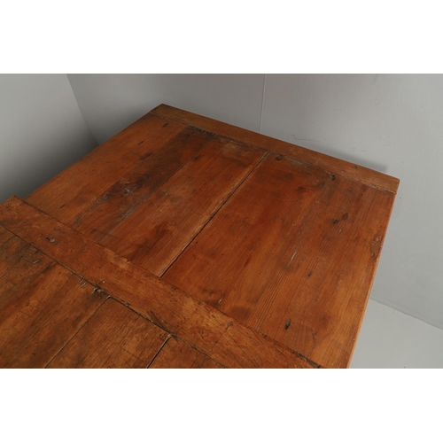 1295 - A 19TH CENTURY FRENCH FRUITWOOD DRAWLEAF FARMHOUSE TABLE. the six plank top to a single drawer at on... 