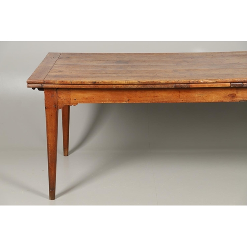 1295 - A 19TH CENTURY FRENCH FRUITWOOD DRAWLEAF FARMHOUSE TABLE. the six plank top to a single drawer at on... 