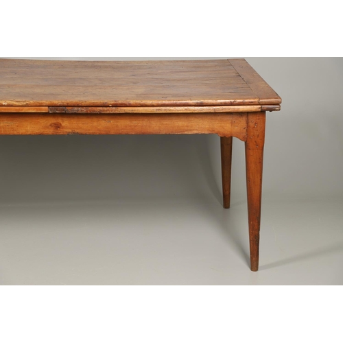 1295 - A 19TH CENTURY FRENCH FRUITWOOD DRAWLEAF FARMHOUSE TABLE. the six plank top to a single drawer at on... 