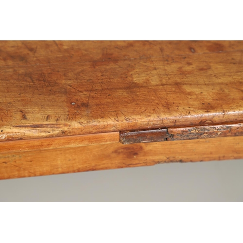 1295 - A 19TH CENTURY FRENCH FRUITWOOD DRAWLEAF FARMHOUSE TABLE. the six plank top to a single drawer at on... 