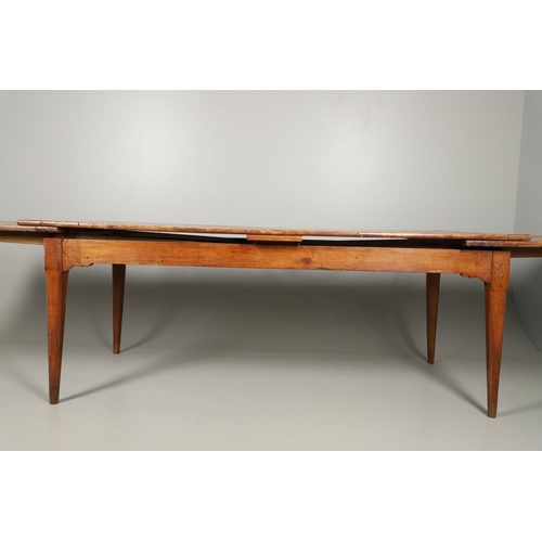 1295 - A 19TH CENTURY FRENCH FRUITWOOD DRAWLEAF FARMHOUSE TABLE. the six plank top to a single drawer at on... 