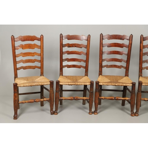 1296 - A SET OF EIGHT OAK AND ELM LADDERBACK DINING CHAIRS. early 20th century, comprising six singles and ... 