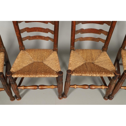 1296 - A SET OF EIGHT OAK AND ELM LADDERBACK DINING CHAIRS. early 20th century, comprising six singles and ... 