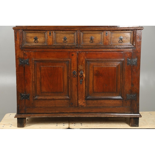 1298 - AN 18TH CENTURY OAK COURT CUPBOARD. the panelled top section with twin cupboards enclosing a vacant ... 