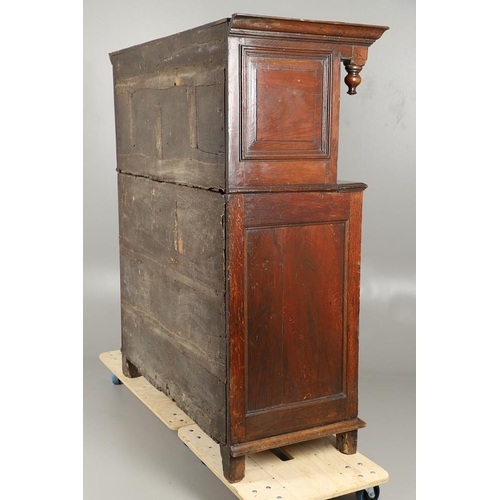 1298 - AN 18TH CENTURY OAK COURT CUPBOARD. the panelled top section with twin cupboards enclosing a vacant ... 