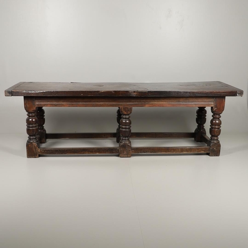 1299 - A 17TH CENTURY OAK REFECTORY TABLE. the single plank top with three unusual cut out hearts above a c... 