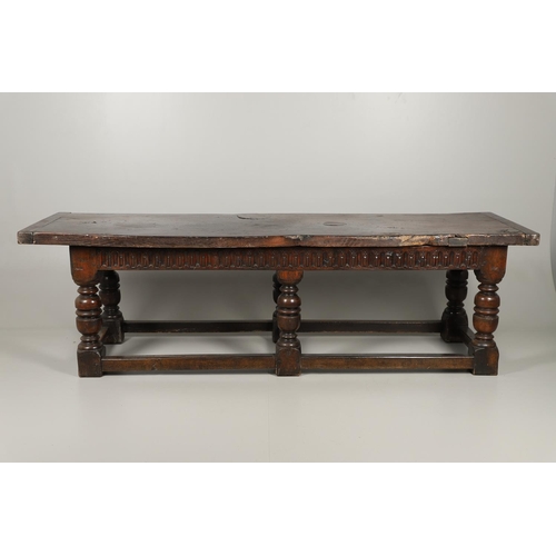 1299 - A 17TH CENTURY OAK REFECTORY TABLE. the single plank top with three unusual cut out hearts above a c... 