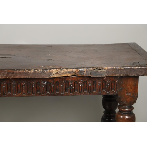 1299 - A 17TH CENTURY OAK REFECTORY TABLE. the single plank top with three unusual cut out hearts above a c... 