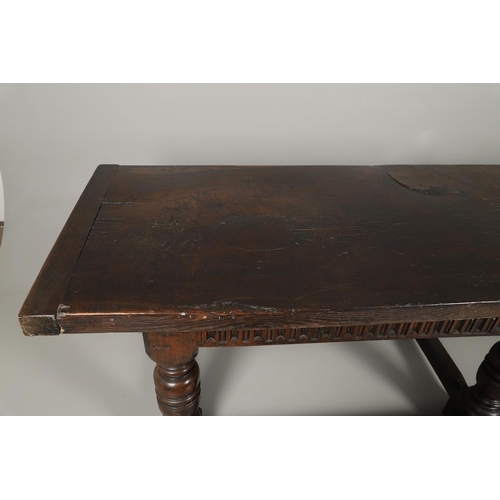 1299 - A 17TH CENTURY OAK REFECTORY TABLE. the single plank top with three unusual cut out hearts above a c... 