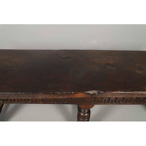 1299 - A 17TH CENTURY OAK REFECTORY TABLE. the single plank top with three unusual cut out hearts above a c... 