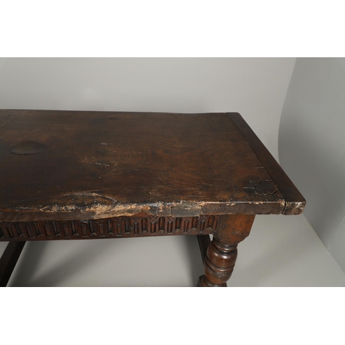 1299 - A 17TH CENTURY OAK REFECTORY TABLE. the single plank top with three unusual cut out hearts above a c... 