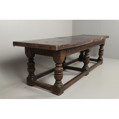 1299 - A 17TH CENTURY OAK REFECTORY TABLE. the single plank top with three unusual cut out hearts above a c... 